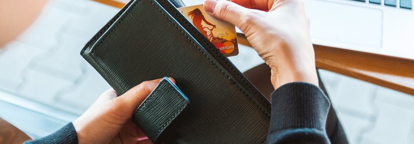 a woman getting her credit card